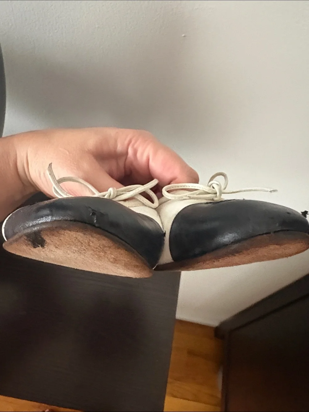 CHANEL White Leather Ballet Flats with Black Cap Toe and Bow